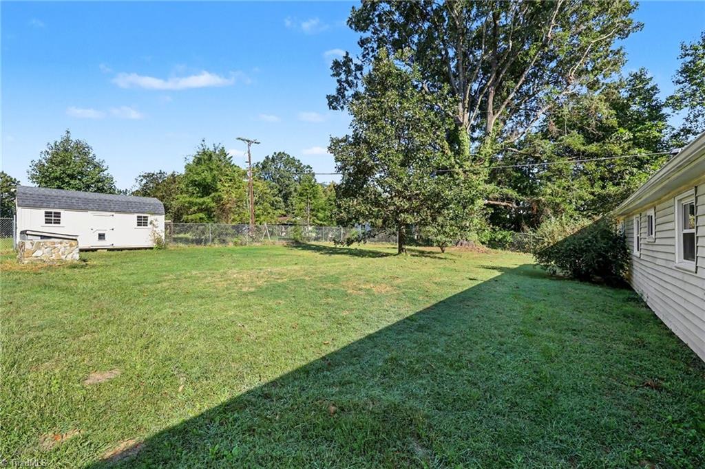 4806 Begonia Road Pleasant Garden, NC 27313 - Photo 28 of 44 Shed, partially fenced in rear yard