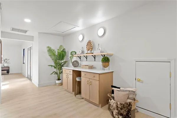 a white bath tub sitting next to a bathroom sink