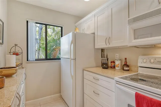 a view of a living room and chandelier