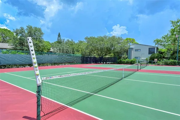 a view of a chairs and table in the balcony