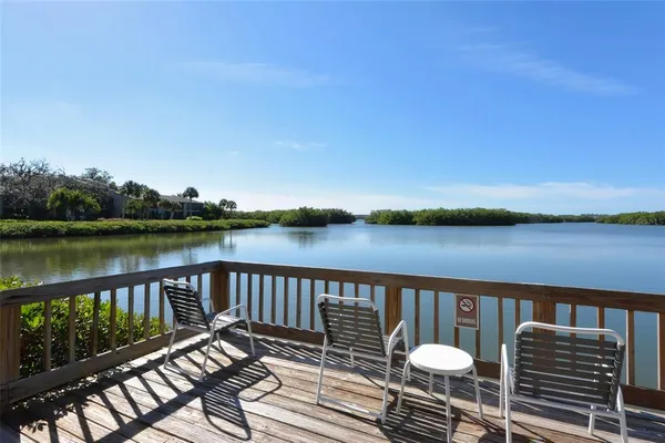 a view of a lake with sitting area
