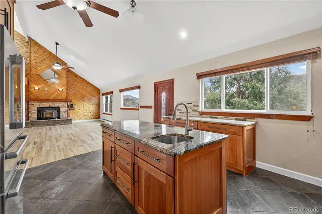 a kitchen that has a sink and a stove