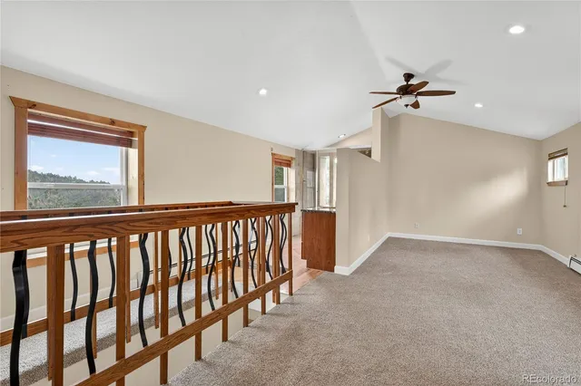 a view of hallway with windows