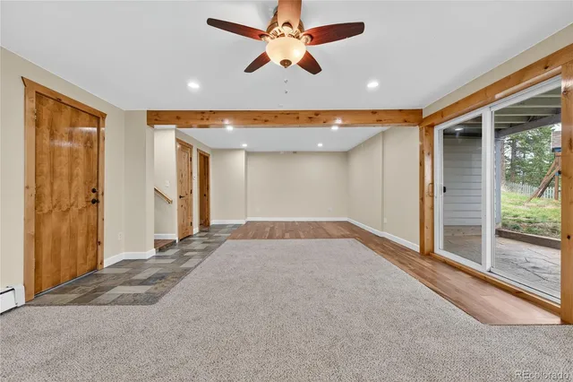 a view of livingroom with hardwood floor and a ceiling fan