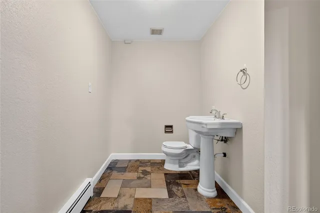a bathroom with a sink toilet and vanity