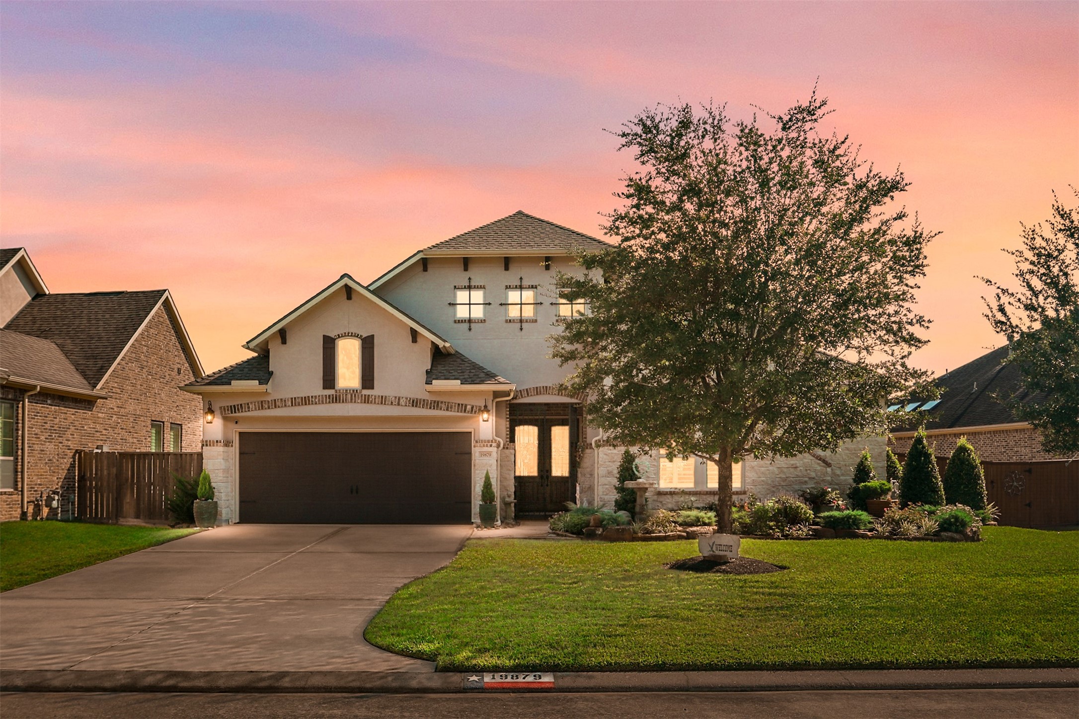 a front view of a house with a yard