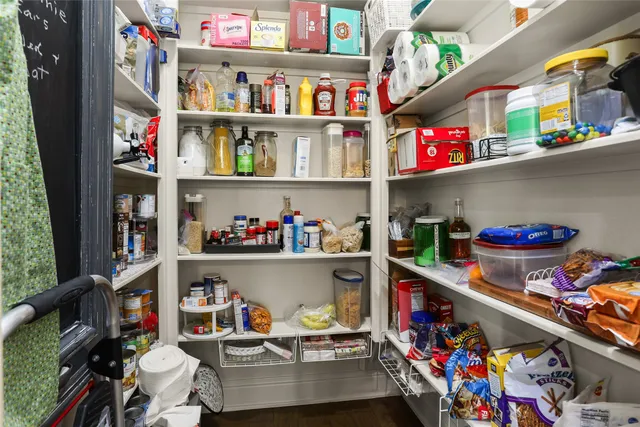 a room with lots of clutter and flowers