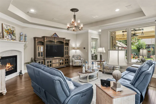 a living room with furniture fireplace and a flat screen tv