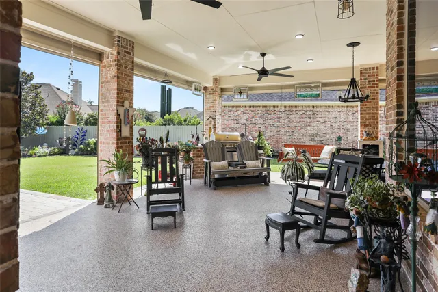 a view of a patio with a table and chairs