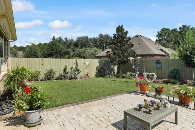 a view of a table and chairs in a garden