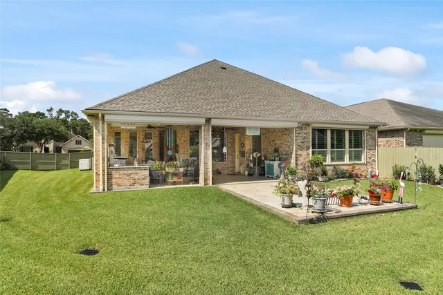 a front view of house with yard and outdoor seating