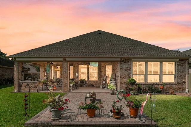 a utility room with water heater and refrigerator