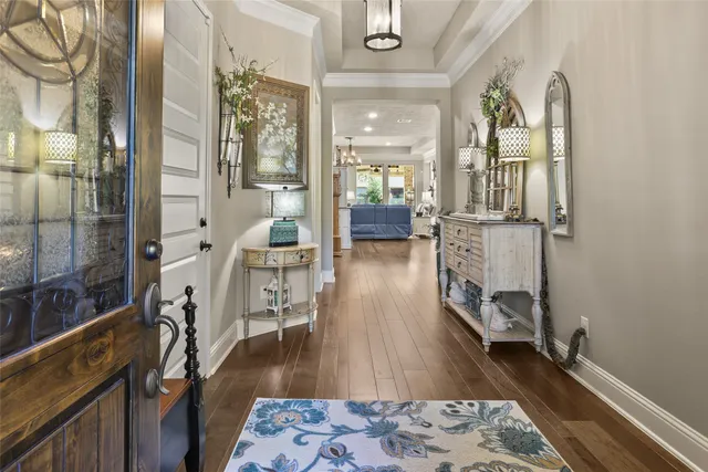 a view of a livingroom with furniture and hardwood floor
