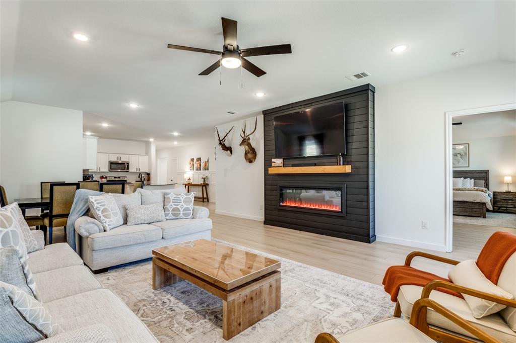 3204 Everly Drive Fate, TX 75189 - Photo 4 of 25 a living room with furniture and a fireplace