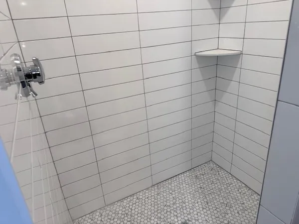 a kitchen with a sink a stove and cabinets