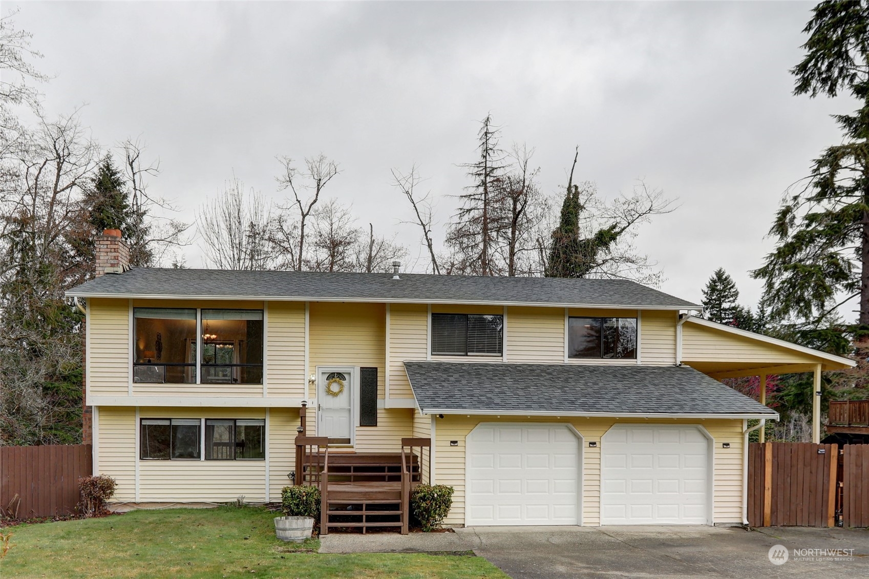 12404 Southeast 227th Street Kent, WA 98031 - Photo 1 of 21 a house view with a garden space