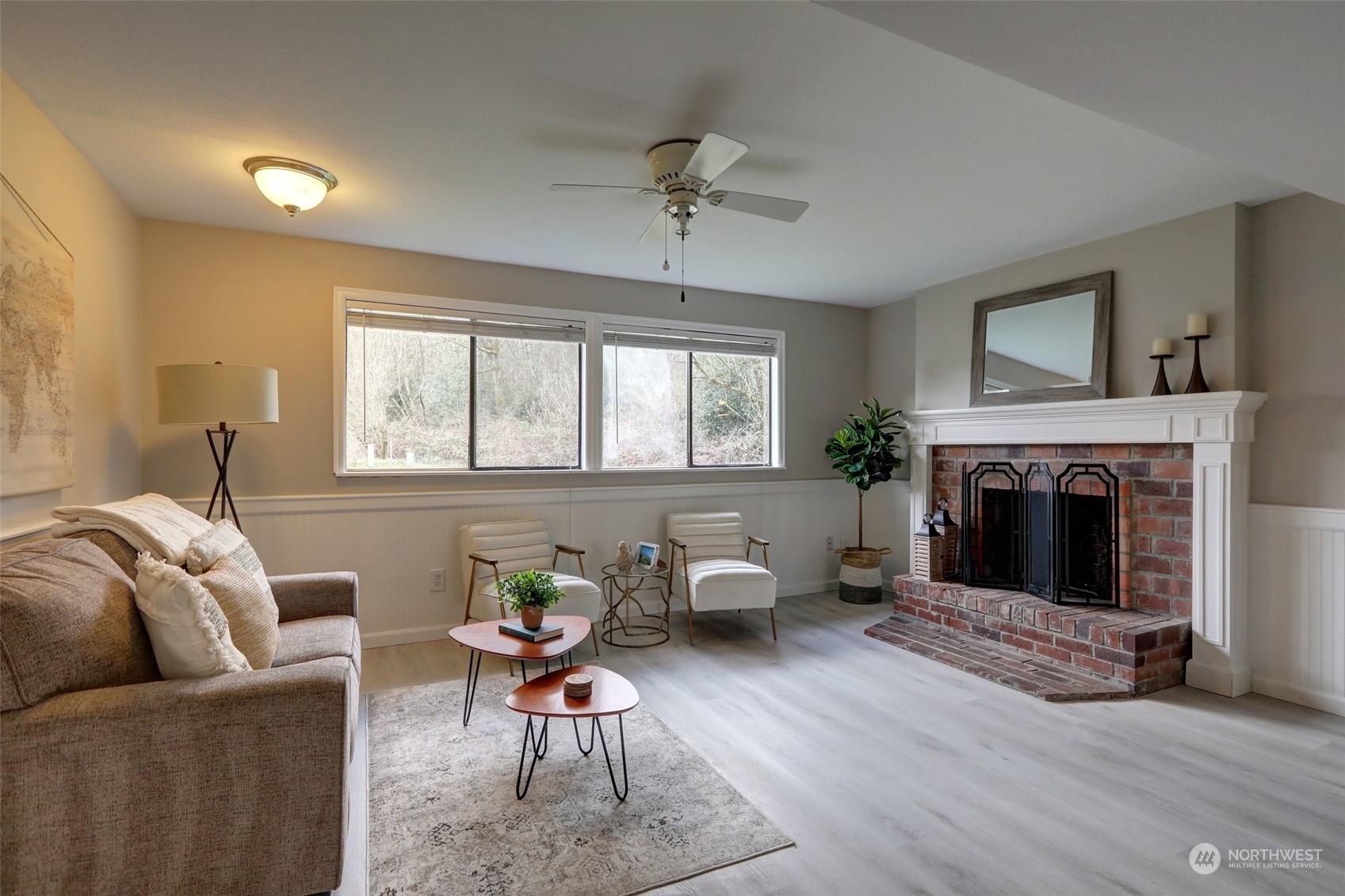 12404 Southeast 227th Street Kent, WA 98031 - Photo 12 of 21 a living room with furniture and a fireplace