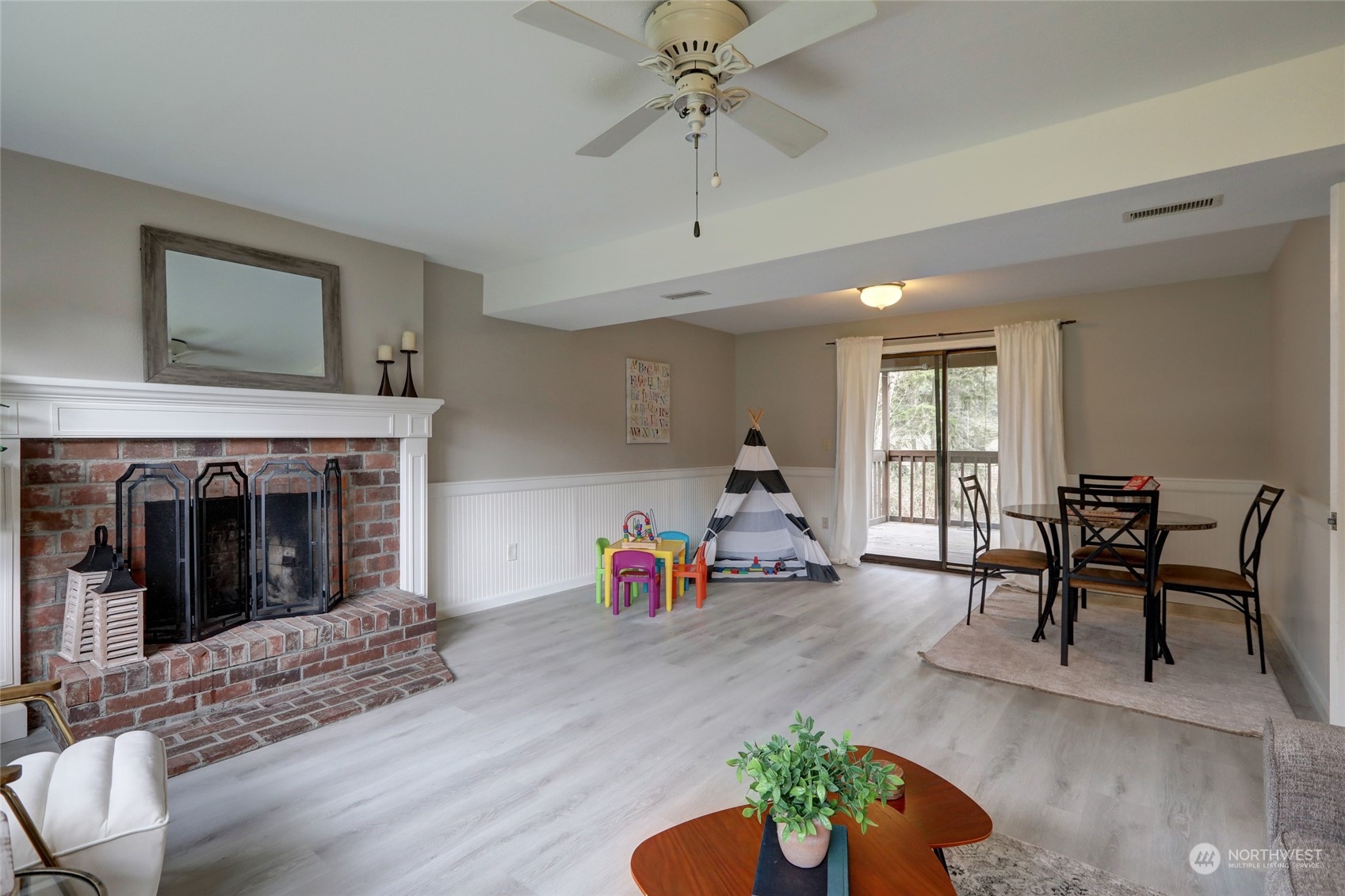 12404 Southeast 227th Street Kent, WA 98031 - Photo 3 of 21 a living room with furniture and a fireplace