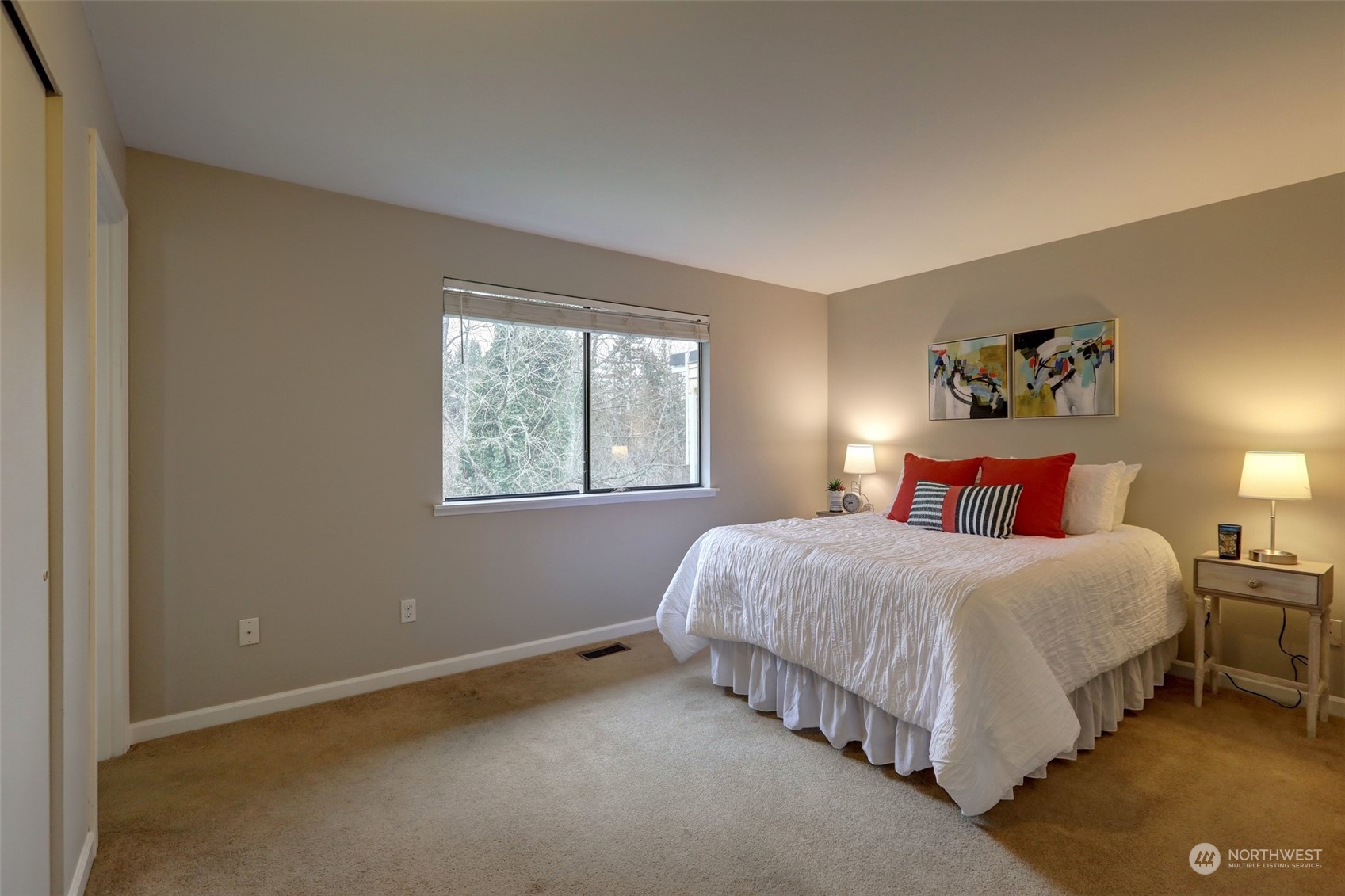 12404 Southeast 227th Street Kent, WA 98031 - Photo 8 of 21 a bedroom with a bed and window