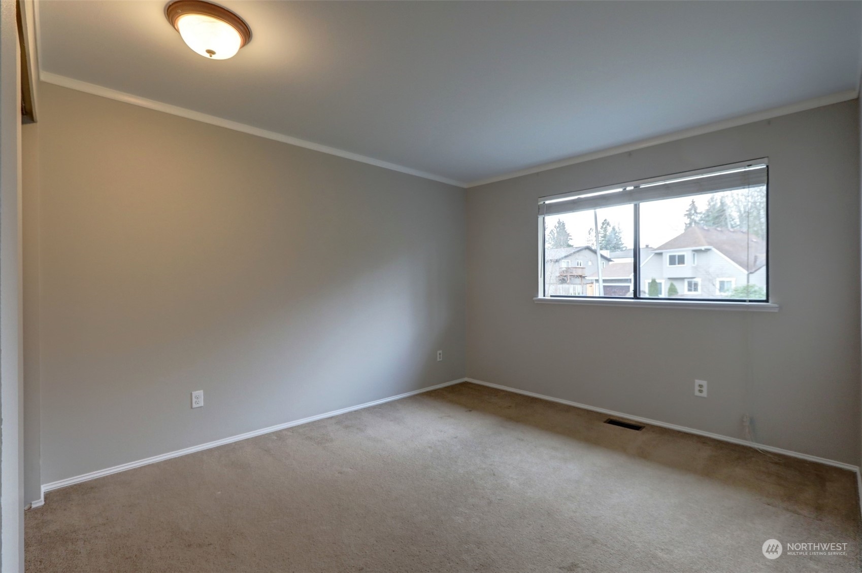 12404 Southeast 227th Street Kent, WA 98031 - Photo 10 of 21 an empty room with windows