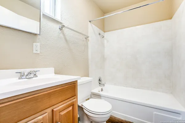 a bathroom with a sink a toilet and a bathtub