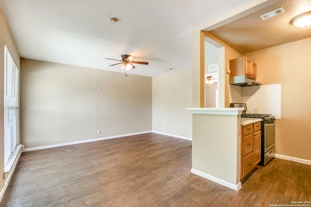 a view of storage and utility room with wooden floor