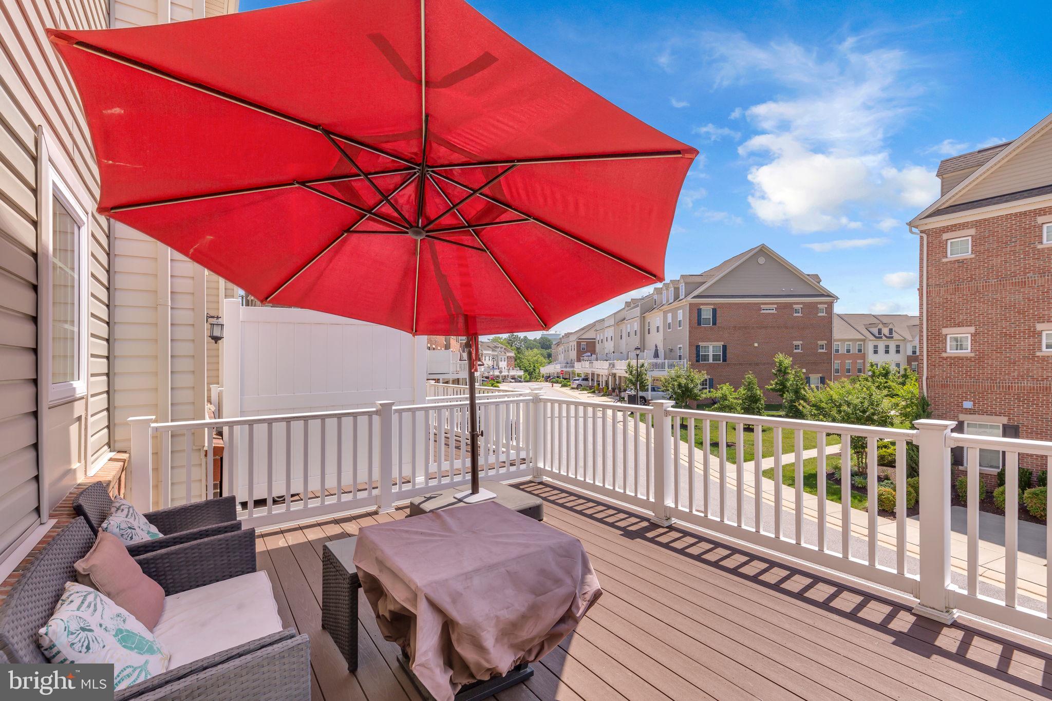 5007 East Joppa Road Perry Hall, MD 21128 - Photo 23 of 28 a view of a balcony with wooden floor and umbrella