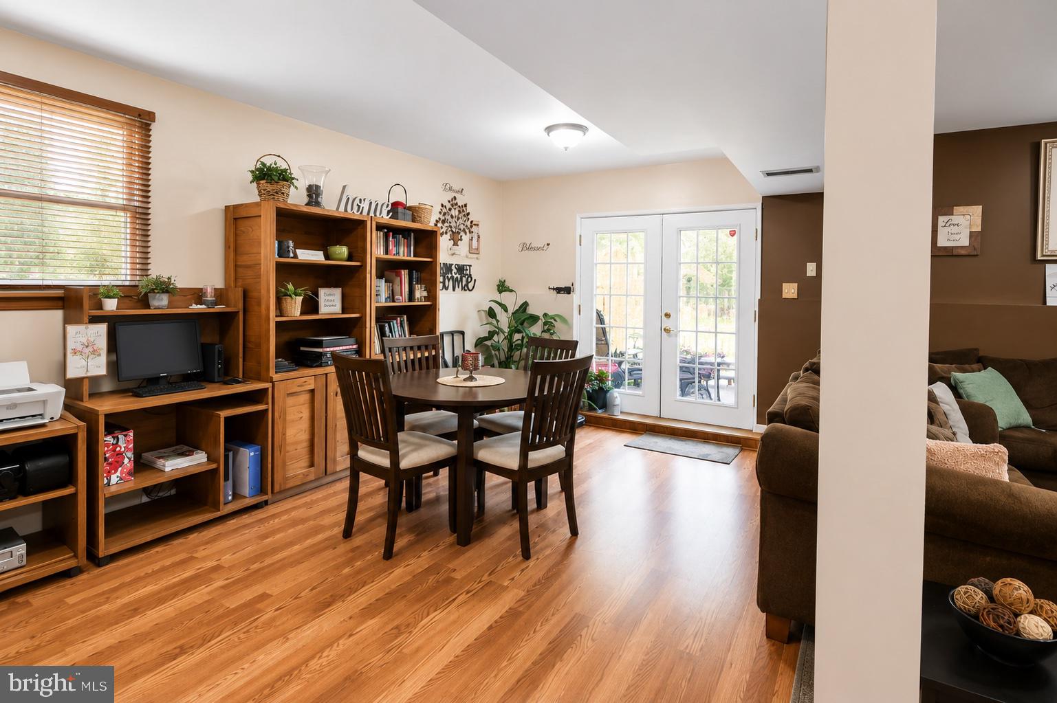 8121 Elizabeth Road Pasadena, MD 21122 - Photo 16 of 27 a dining room with furniture and wooden floor