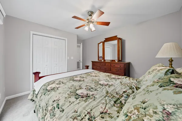 a bedroom with a bed and a dresser
