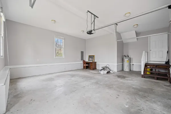 a view of a livingroom with furniture and a window