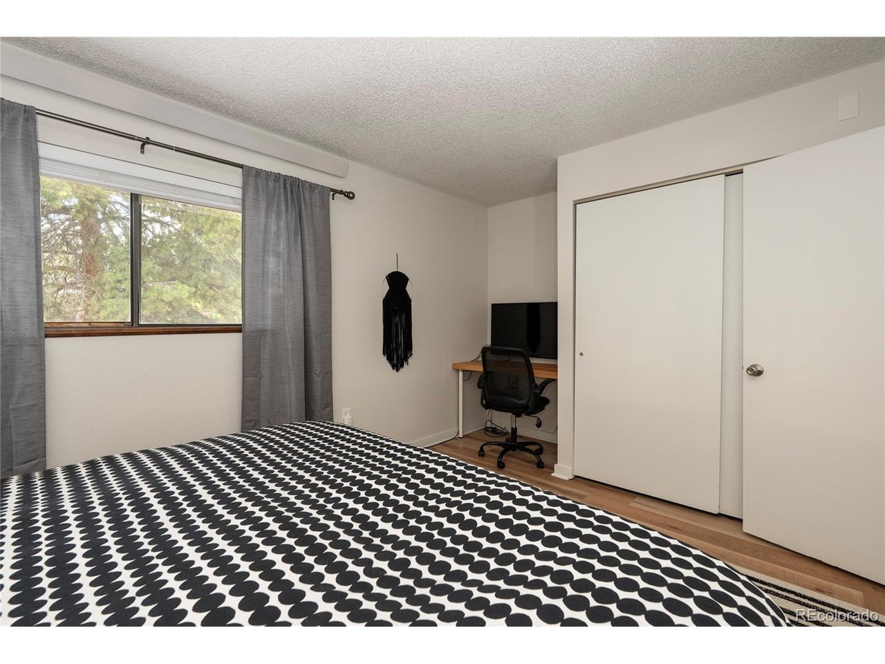 62 County Road 838, Unit 4 Fraser, CO 80442 - Photo 11 of 39 a bedroom with a bed and a window