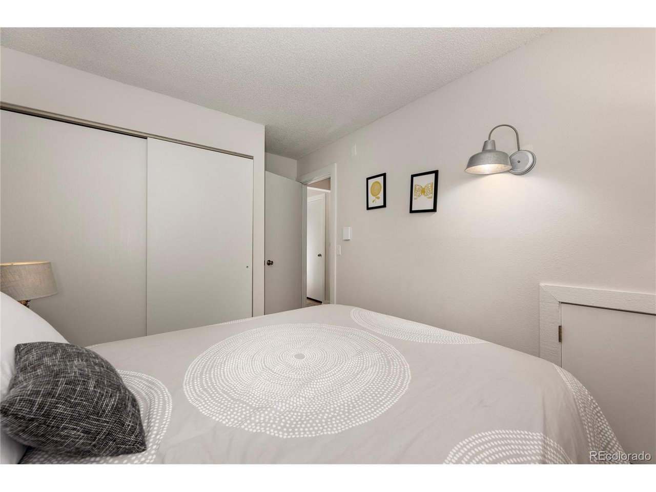 62 County Road 838, Unit 4 Fraser, CO 80442 - Photo 14 of 39 a bedroom with a bed and a table