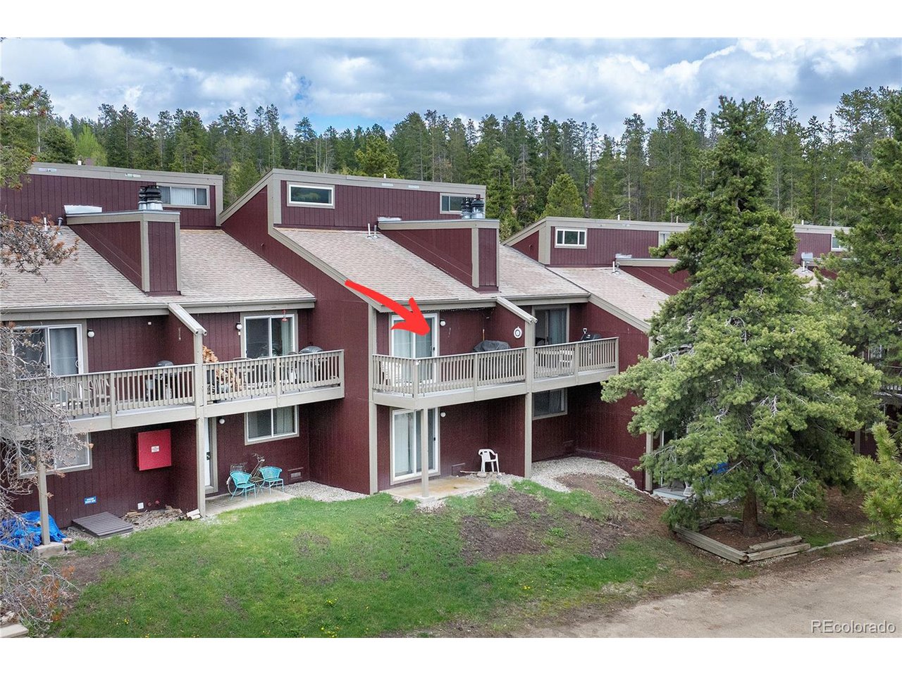 62 County Road 838, Unit 4 Fraser, CO 80442 - Photo 21 of 39 a view of a big house with a big yard and large tree