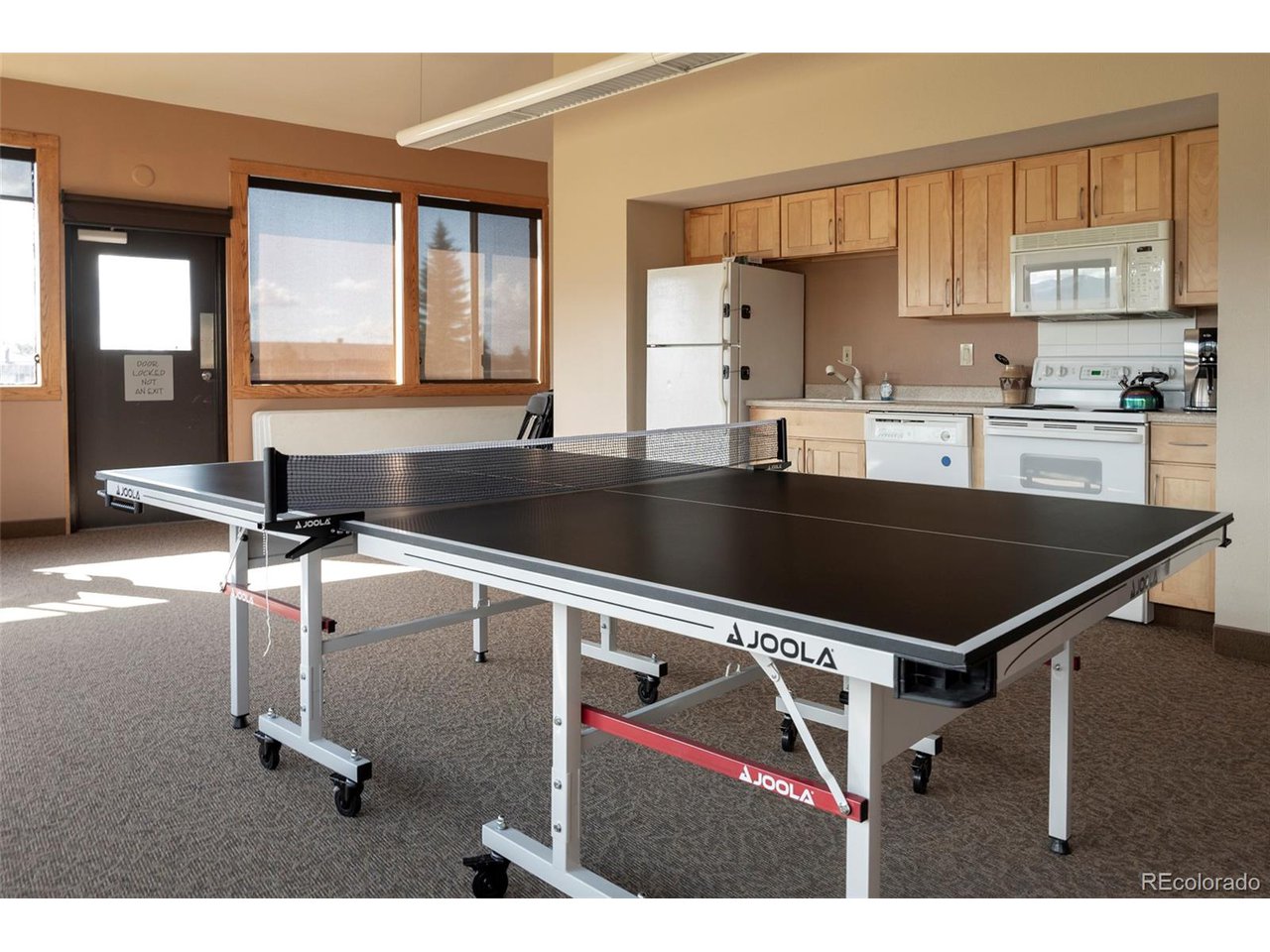 62 County Road 838, Unit 4 Fraser, CO 80442 - Photo 36 of 39 a kitchen with a stove a sink and a refrigerator