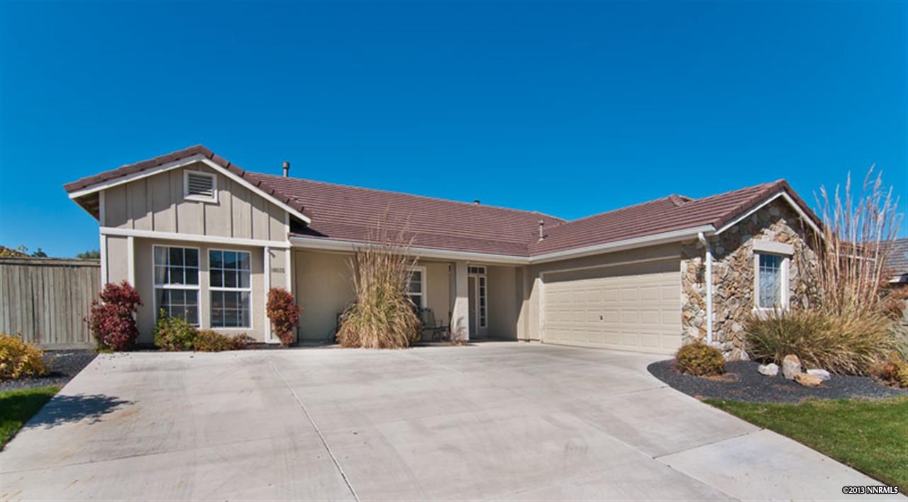 10555 Iron Ridge Court Reno, NV 89521 - Photo 1 of 1 a front view of a house with a yard and garage
