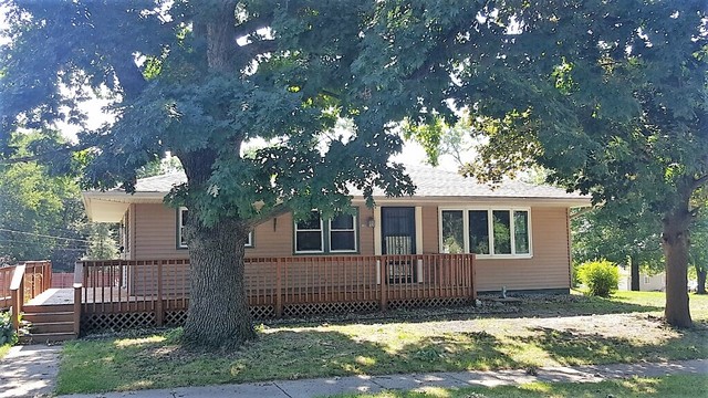 130 West Iowa Street Spring Valley, IL 61362 - Photo 1 of 7 a house that has a tree in front of the house