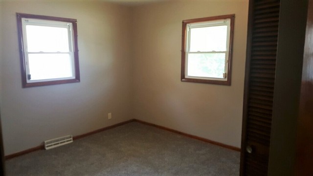 130 West Iowa Street Spring Valley, IL 61362 - Photo 5 of 7 an empty room with a window