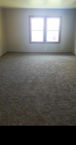 130 West Iowa Street Spring Valley, IL 61362 - Photo 6 of 7 a view of an empty room with a window