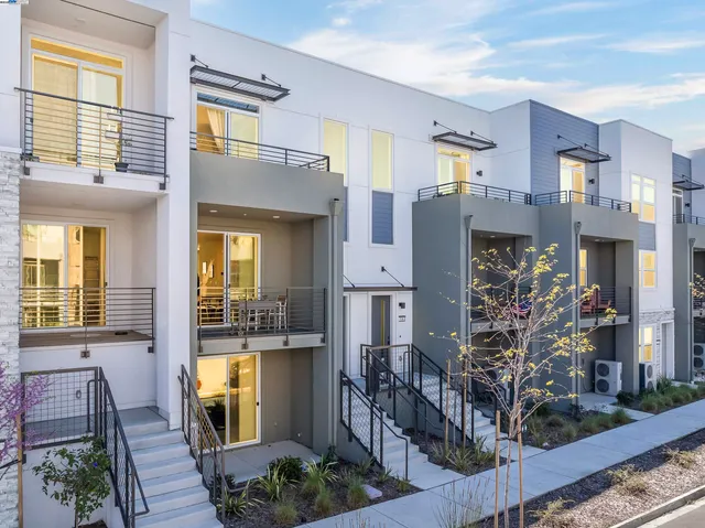 a very nice looking room with a large window and wooden floor