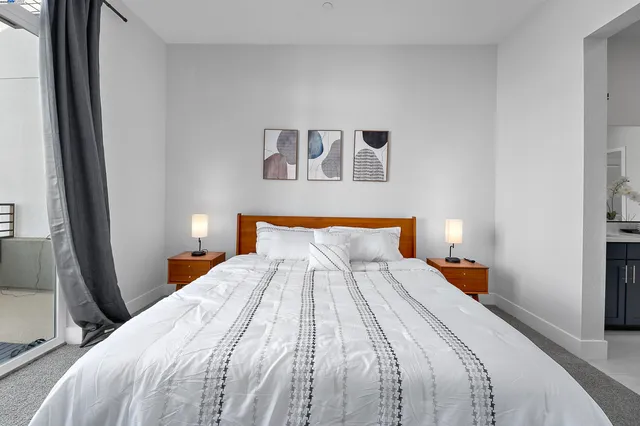 a bedroom with a bed and a mirror