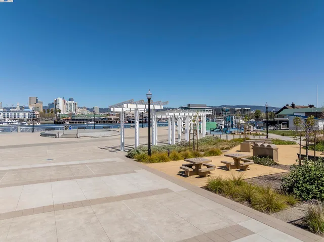 a view of swimming pool with outdoor seating and city view