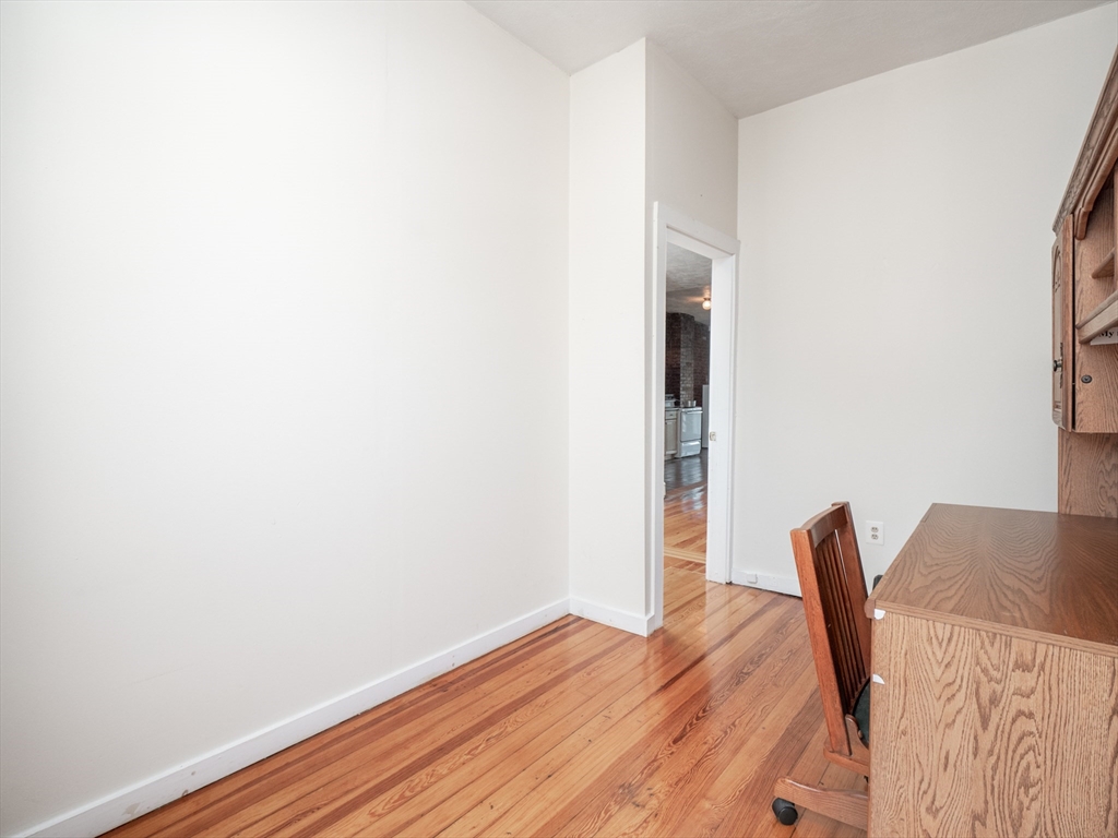 4 Saxton Street Boston, MA 02125 - Photo 5 of 14 a view of a room with wooden floor and chair