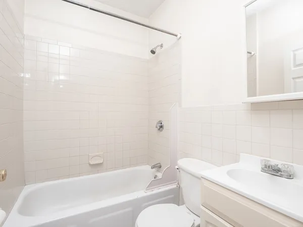 a bathroom with a sink a toilet and a bathtub