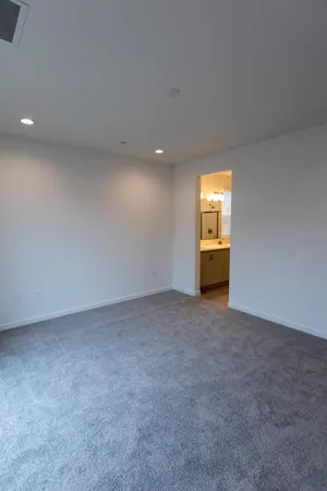 a view of empty room with a fireplace