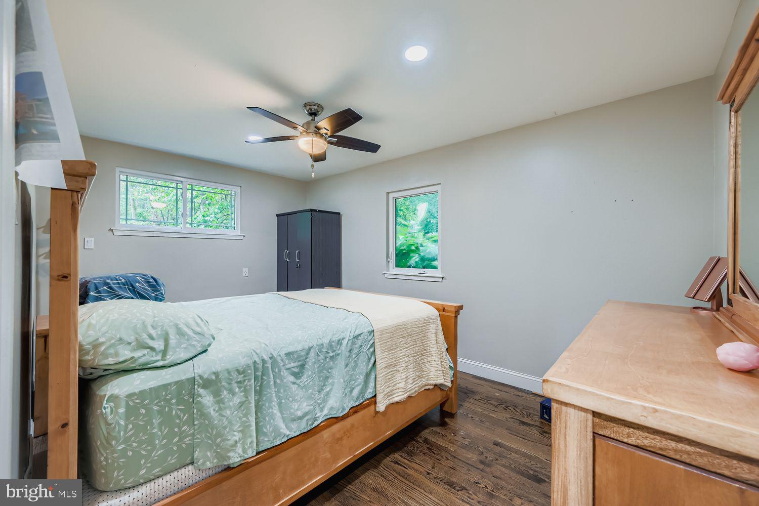 3203 Brezina Place Edgewater, MD 21037 - Photo 17 of 42 a bedroom with a bed and a table