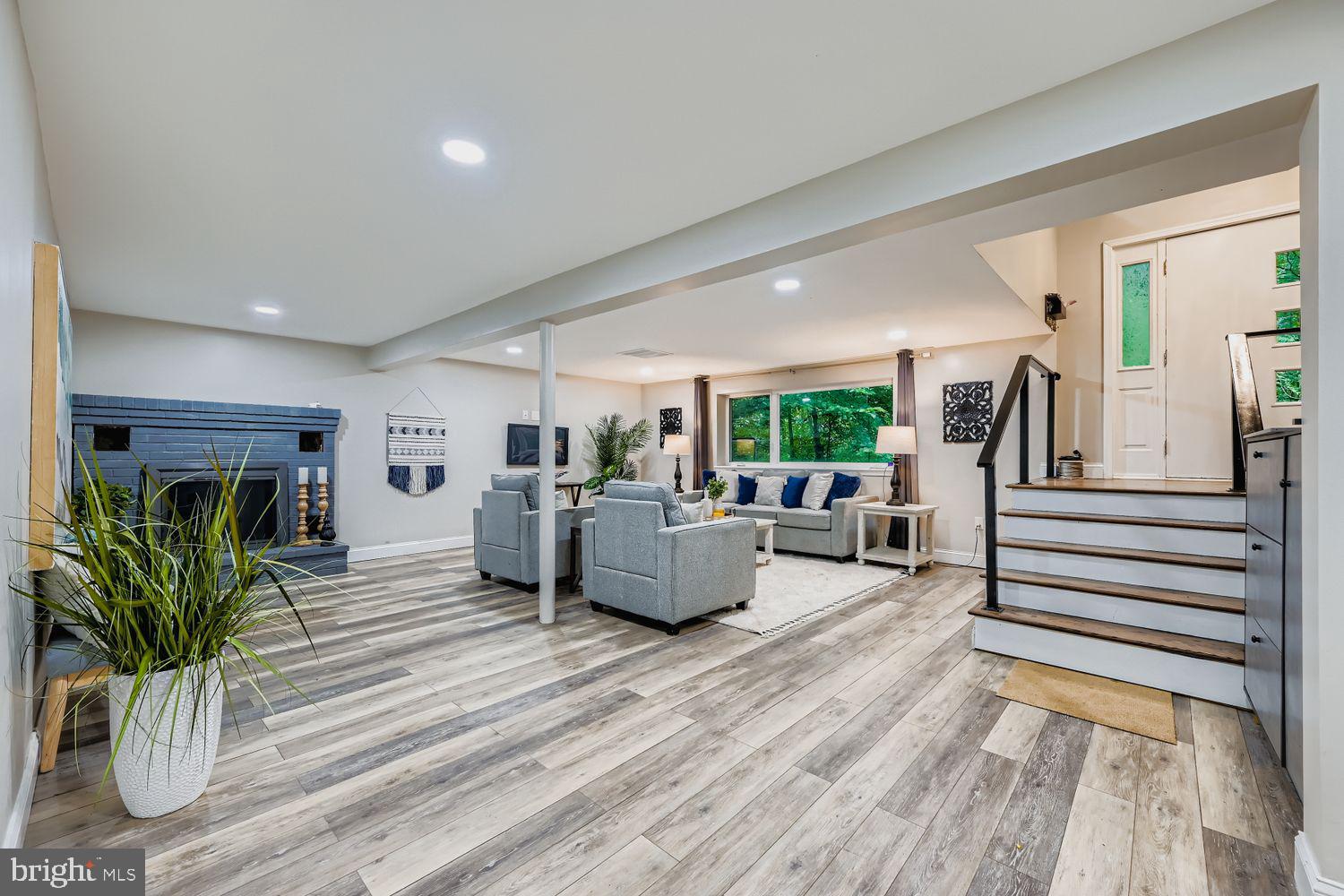 3203 Brezina Place Edgewater, MD 21037 - Photo 20 of 42 a living room with furniture and a wooden floor