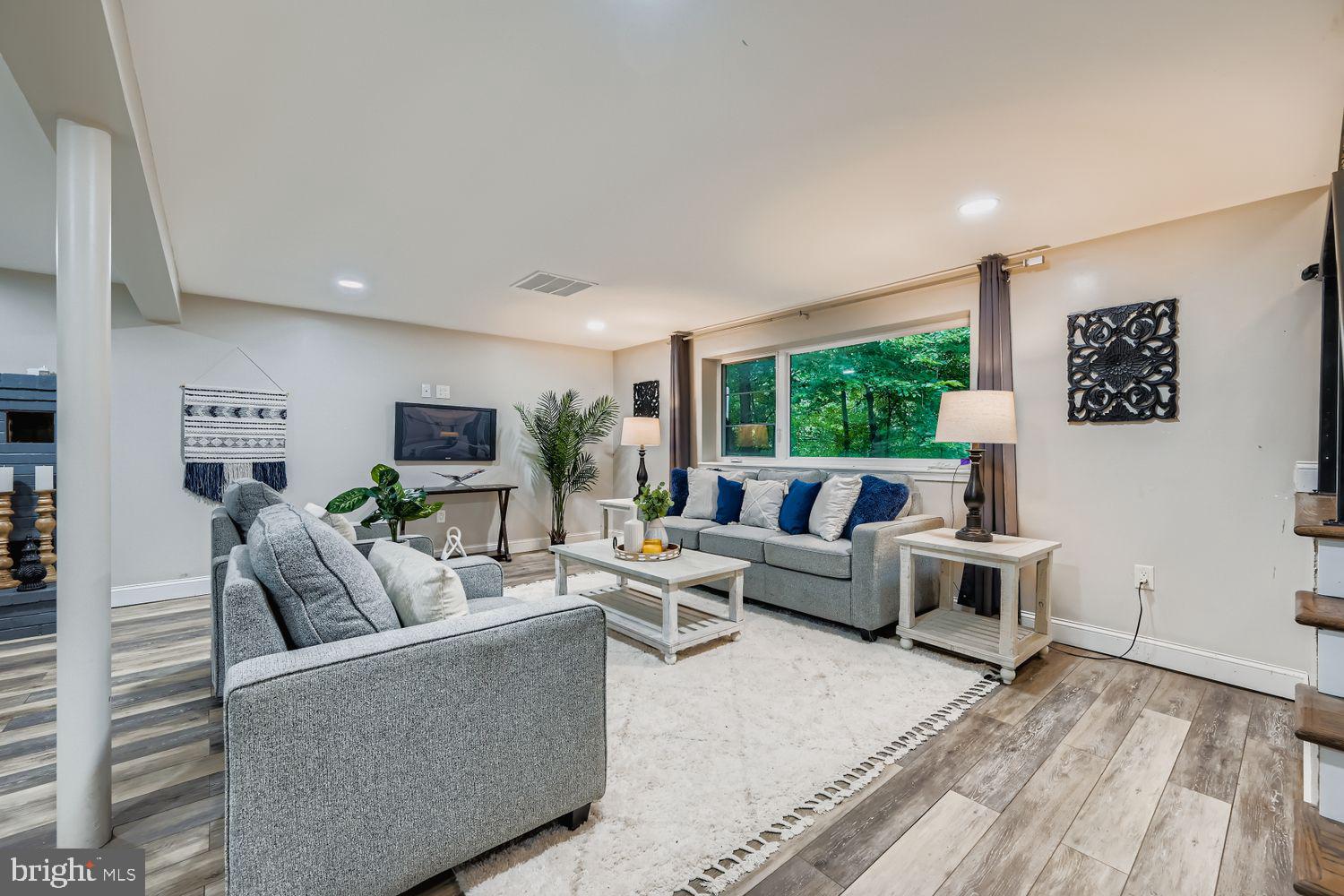 3203 Brezina Place Edgewater, MD 21037 - Photo 21 of 42 a living room with furniture and a flat screen tv