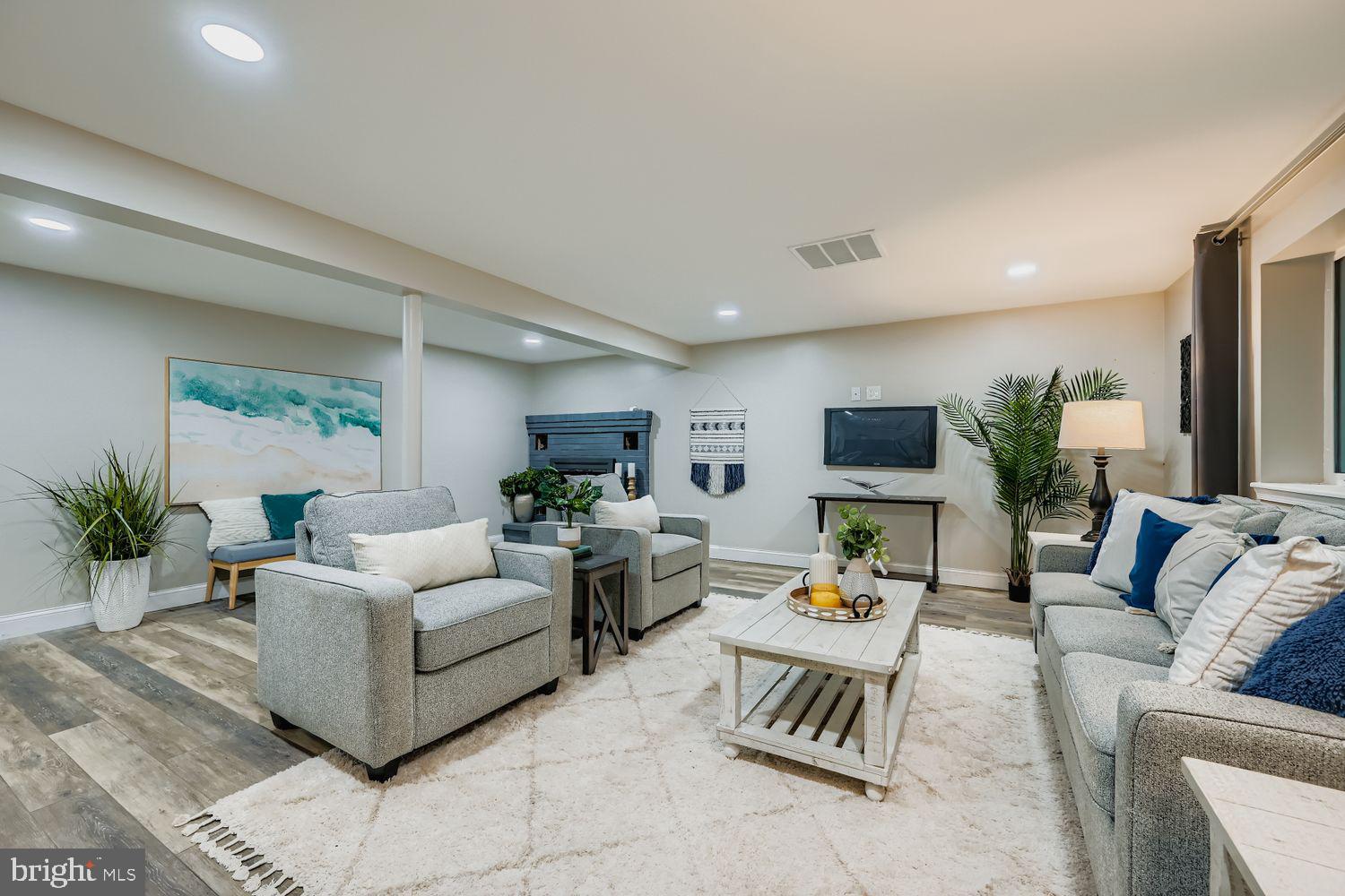 3203 Brezina Place Edgewater, MD 21037 - Photo 22 of 42 a living room with furniture and a couch