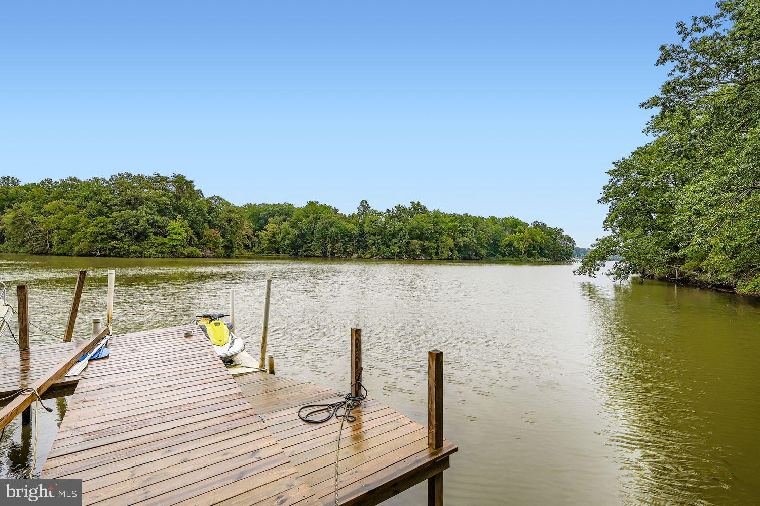 3203 Brezina Place Edgewater, MD 21037 - Photo 37 of 42 a view of a lake with couches chairs