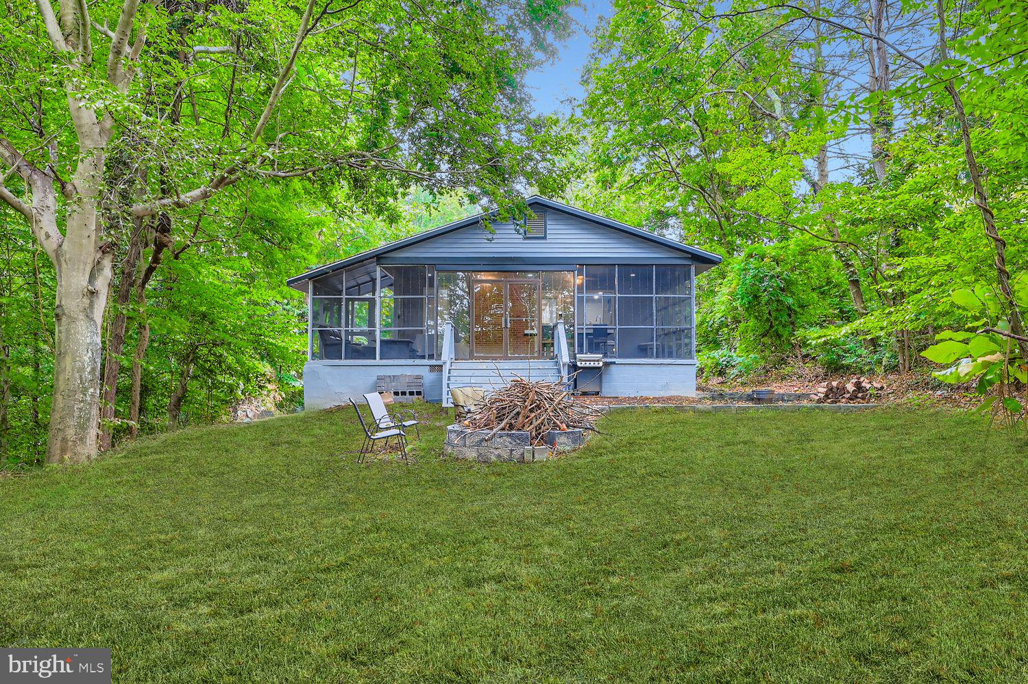 3203 Brezina Place Edgewater, MD 21037 - Photo 41 of 42 a front view of a house with garden